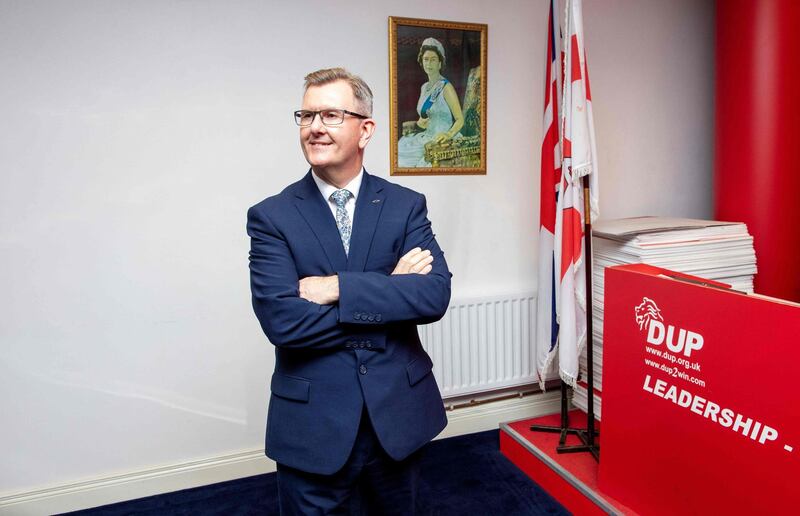 (FILES) In this file photo taken on May 3, 2021, Democratic Unionist Party (DUP) MP Jeffrey Donaldson poses for a photo at the party's headquarters after officially announcing that he is entering the race to become the next leader of the party, in Belfast. British MP Jeffrey Donaldson on June 21, 2021, announced his candidacy for the leadership of Northern Ireland's unionist DUP party, after internal divisions forced the party's leader to resign amid Brexit-related tensions. / AFP / Paul Faith
