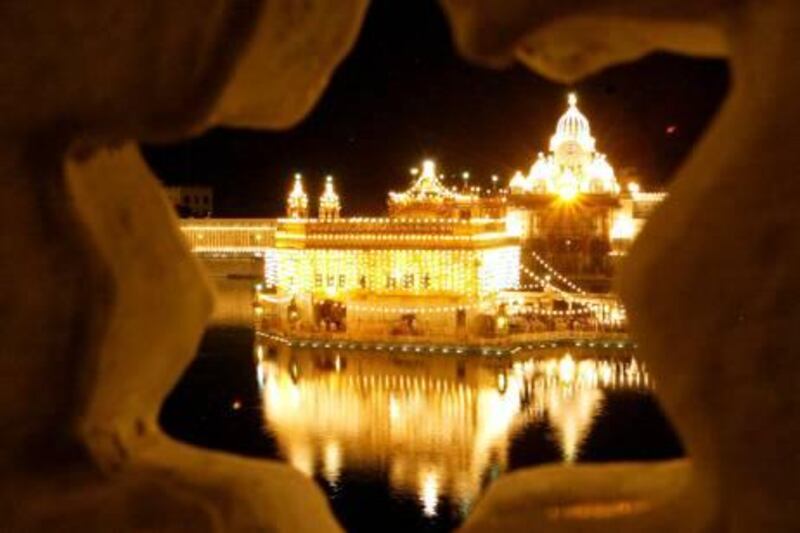 A view of the Golden Temple, illuminated as part of preparations for celebrations for the 400th anniversary of the installation of the Sikh holy book, Sri Guru Granth Sahib, in Amritsar, India, Wednesday, Aug. 25, 2004. The anniversary will be celebrated on Sept. 1. (AP Photo/Aman Sharma)
