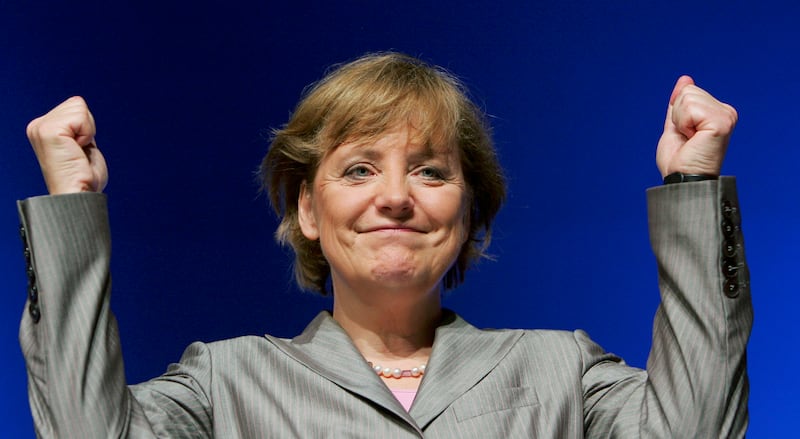 Mrs Merkel raises her fists at the Lower Saxony Christian Democratic Party's annual general meeting in 2005. Getty Images