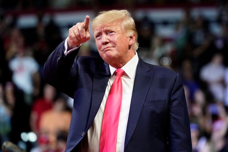 Mr Trump prepares to speak at a rally in Phoenix, Arizona. AP