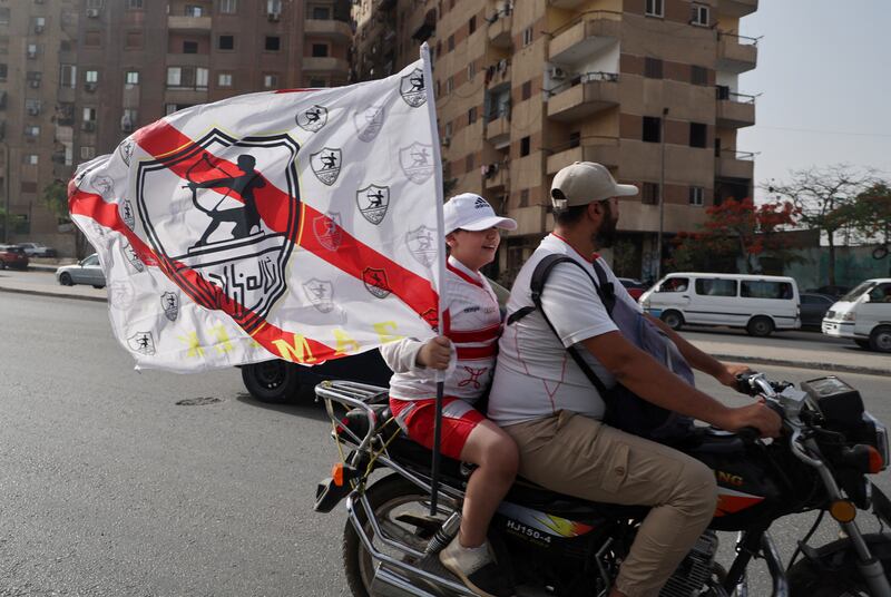 Zamalek fans wave a flag outside the stadium before the match. Reuters