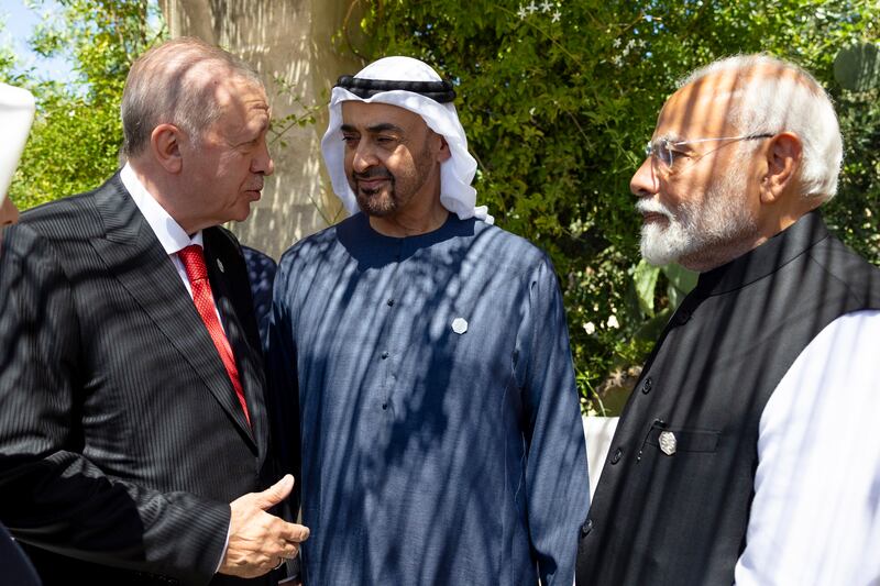 Sheikh Mohamed, Mr Modi and Mr Erdogan, speak on the sidelines of the summit. Ryan Carter / UAE Presidential Court 