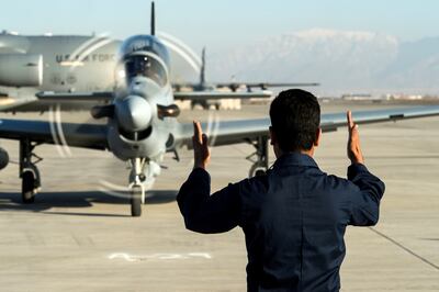 A member of Afghanistan's air force guides a jet at Hamid Karzai International Airport near Kabul, in 2016. Photo: Reuters