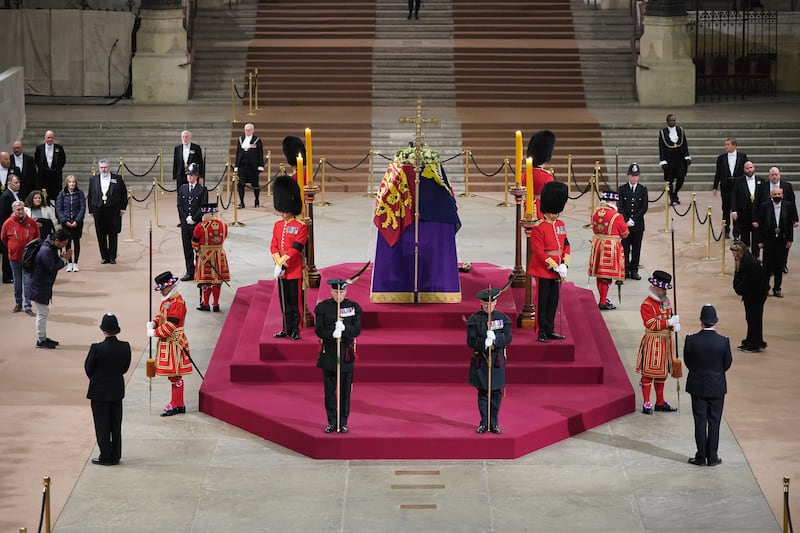 At 6.28am on the day of her funeral, the final members of the public pay their respects at the coffin of Queen Elizabeth at the Palace of Westminster, London. PA