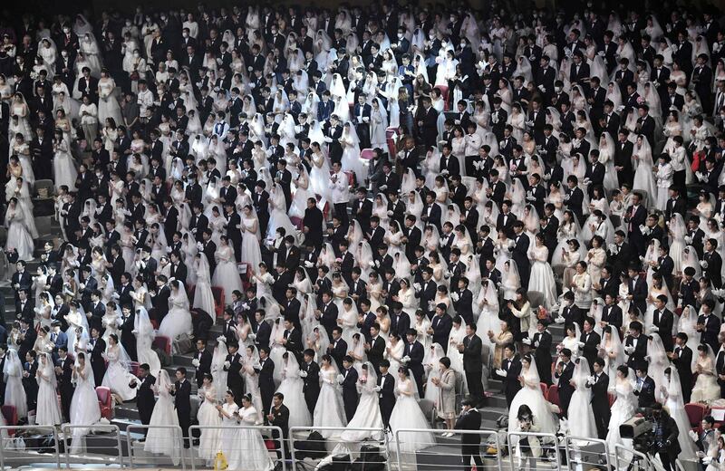 Couples attend a mass wedding ceremony organised by the Unification Church at Cheongshim Peace World Center in Gapyeong.  AFP