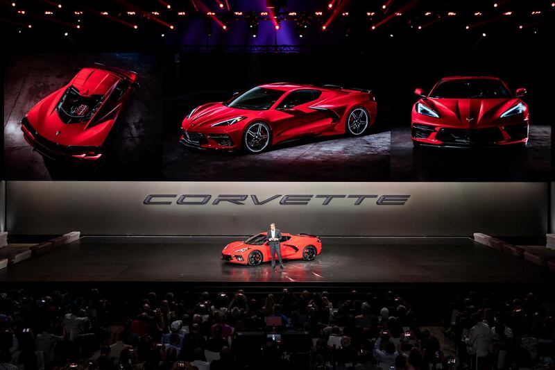Mark Reuss delivers a speech alongside the next generation Corvette. EPA