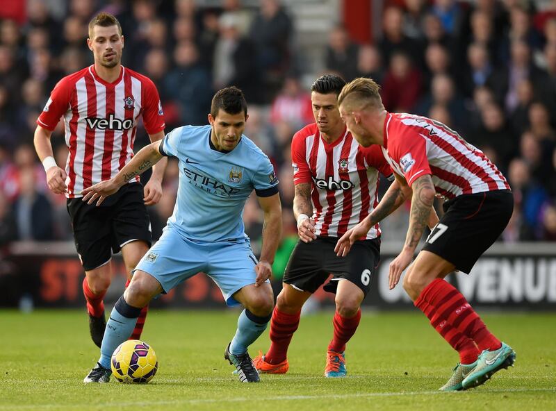 SOUTHAMPTON, ENGLAND - NOVEMBER 30:  Sergio Aguero of Manchester City is tightly marked during the Barclays Premier League match between Southampton and Manchester St Mary's Stadium on November 30, 2014 in Southampton, England.  (Photo by Mike Hewitt/Getty Images)