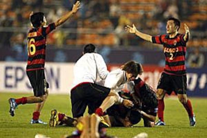 Pohang Steelers celebrate after the final whistle in the game against Al Ittihad.