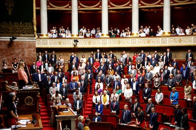 Members of parliament observe a minute of silence after a knife attack in Annecy that left several children injured. Reuters 