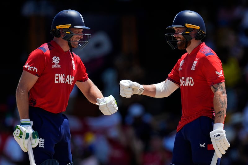 England captain Jos Buttler, left, and Phil Salt celebrate during their 10-wicket Super Eight victory against the USA at Kensington Oval in Bridgetown, Barbados, on Sunday, June 23, 2024. The win takes England into the T20 World Cup semi-finals. AP 
