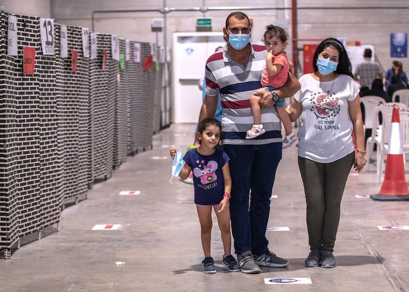 The Mansour family from Egypt attended a clinic in Abu Dhabi on Wednesday to get their oldest child tested for Covid-19 before returning to school next week. 