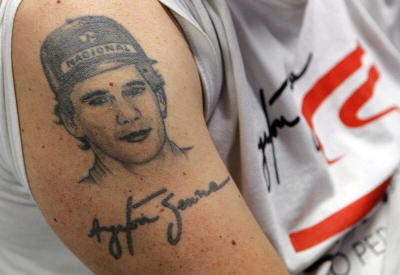 A fan displays his Ayrton Senna tattoo during a mass on Wednesday at the Imola race track in Italy where Ayrton Senna was killed on May 1, 1994. Alessandro Garofalo / Reuters / April 30, 2014