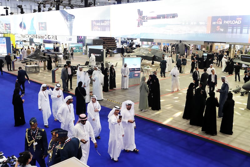 Visitors at the Dubai Airshow. The event has attracted more than 1,400 exhibitors from 95 countries. Pawan Singh / The National