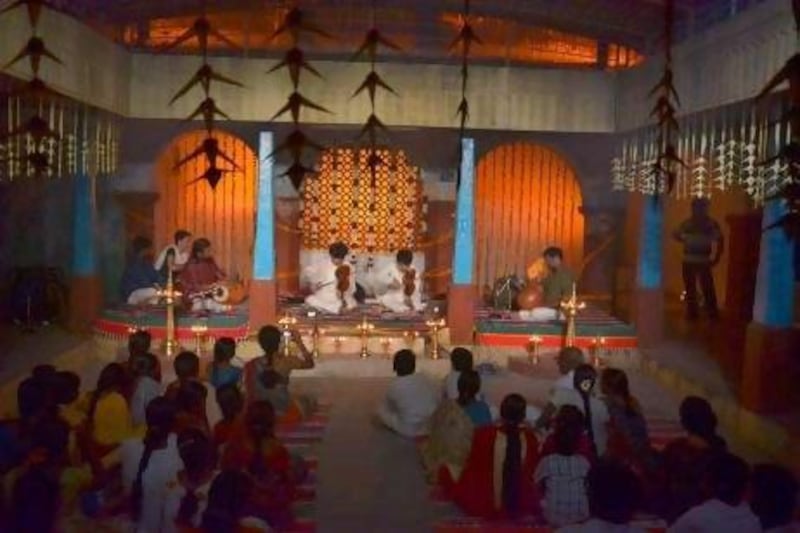Violinists perform in the Chettiar Chathram, a performance space in Thiruvaiyaru, Tamil Nadu.