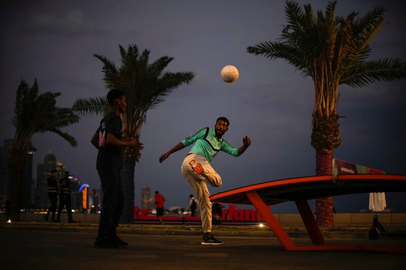 Footballers show their skills at the Corniche, in Qatari capital Doha. AP Photo