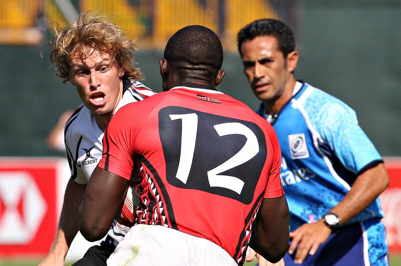 Dubai , United Arab Emirates, Dec 3 2011, UAE v Kenya , Sports Reporter Paul Radley  story- (right centre) UAE's #2 Chris Gregory lines up a tackle as (centre) #12 Kenya's Dennis Ombachi attempts to dunny Gregory off during action at the Emirates airlenes Dubai Rugby Sevens. Mike Young / The National
