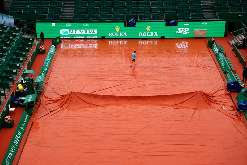 Rain covers protect a court before play at the Monte Carlo Masters tennis tournament. Reuters