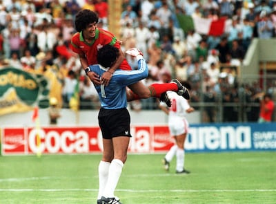 Morocco goalkeeper Badou Zaki celebrates with Mustapha Biaz after the team qualified for the 1986 World Cup knockout stages by beating Portugal. AFP