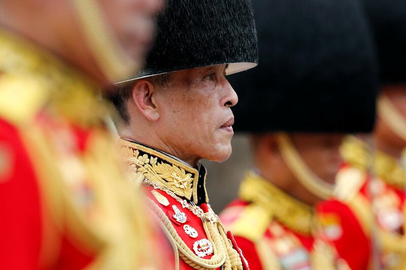 Thailand's King Maha Vajiralongkorn takes part in the royal cremation procession at the Grand Palace in Bangkok. Jorge Silva / Reuters.