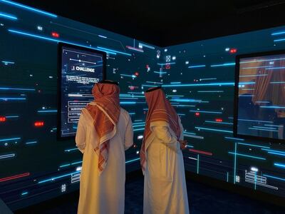 Attendees testing their cyber threat management skills at a special corner called ‘Cyber Cube’ at the Global Cybersecurity Forum at Riyadh's Ritz Carlton hotel on Tuesday. Alkesh Sharma / The National