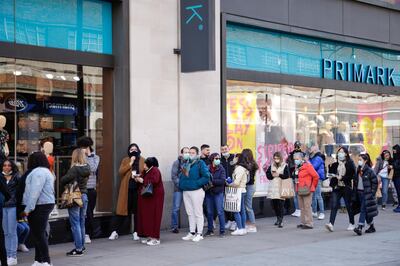 Customers queue outside a Primark clothing store following its reopening on Oxford Street in central London, U.K., on Monday, April 12, 2021. Consumers flocked to shopping streets across England on Monday as non-essential retailers reopened after almost 100 days of lockdown, along with pubs and restaurants with outdoor space. Photographer: Jason Alden/Bloomberg