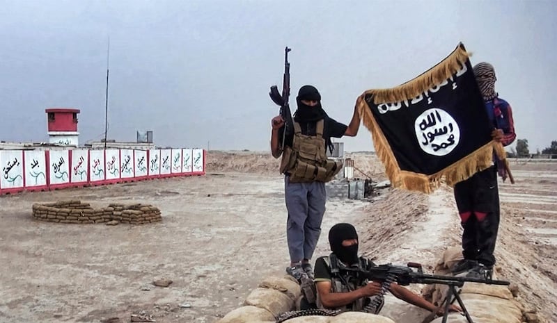 An image made available on the jihadist website Welayat Salahuddin on June 11, 2014 shows militants of the Islamic State of Iraq and the Levant (ISIL) posing with the trademark Jihadists flag after they allegedly seized an Iraqi army checkpoint in the northern Iraqi province of Salahuddin. Jihadists are pushing toward Baghdad on June 12, 2014 after capturing a town just hours to the north, as the US mulled air strikes in a bid to bolster Iraq's collapsing security forces. AFP PHOTO / HO / WELAYAT SALAHUDDIN
=== RESTRICTED TO EDITORIAL USE - MANDATORY CREDIT "AFP PHOTO / HO / WELAYAT SALAHUDDIN" - NO MARKETING NO ADVERTISING CAMPAIGNS - DISTRIBUTED AS A SERVICE TO CLIENTS FROM ALTERNATIVE SOURCES, THEREFORE AFP IS NOT RESPONSIBLE FOR ANY DIGITAL ALTERATION === / AFP PHOTO / WELAYAT SALAHUDDIN / -