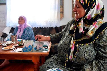 Bosnian Muslim woman Ramiza Gurdic (R), 67, survivor of Srebrenica 1995 massacre, lost her husband and two underage sons in the Srebrenica genocide. AFP