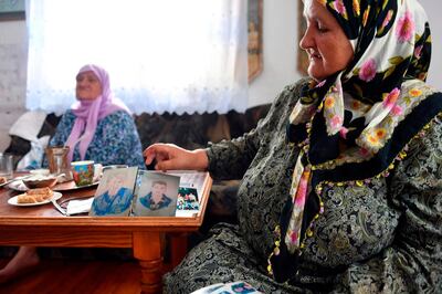 Bosnian Muslim woman Ramiza Gurdic (R), 67, survivor of Srebrenica 1995 massacre, cries as she remembers losing her husband and 2 underage sons in the massive killing of Srebrenica during Bosnia's 1992-95 war on July 3, 2020. Eight thousands Muslim men and boys were killed by Serb forces in the eastern enclave towards the end of Bosnia's 1992-95 war, an atrocity deemed a genocide by international courts, whose remains were found in mass graves after the conflict, were buried a decade ago in the memorial centre where more than 6,600 victims of the victims lie.
Another 237 have been laid to rest at other sites. But more than 1,000 people have never been found, an acute source of pain for survivors.
 / AFP / ELVIS BARUKCIC
