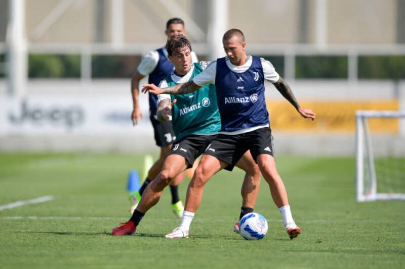 Luca Pellegrini and Federico Bernardeschi during Juventus' training session.