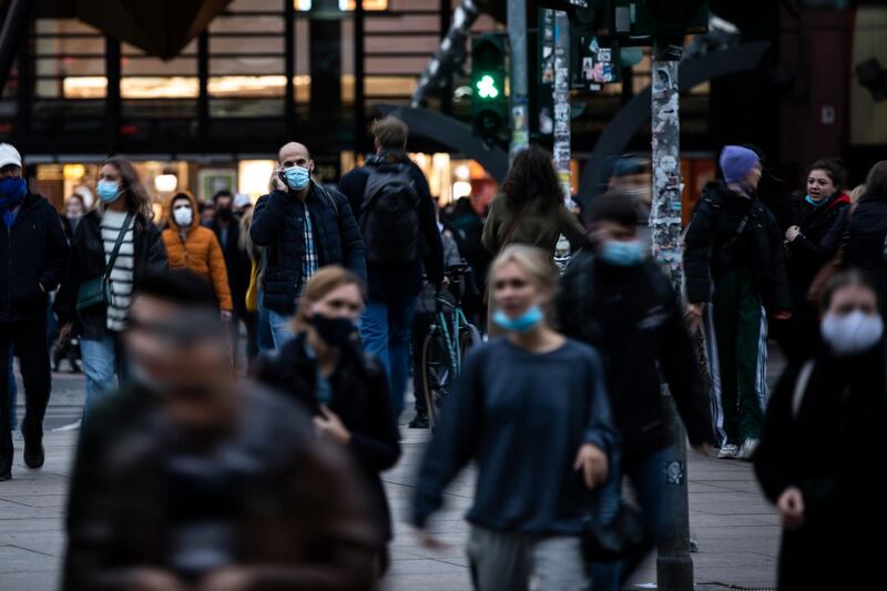 People walk near Alexanderplatz in Berlin. Germany's Covid-19 daily infection passed 6,000 after rising steadily since August.  Getty Images