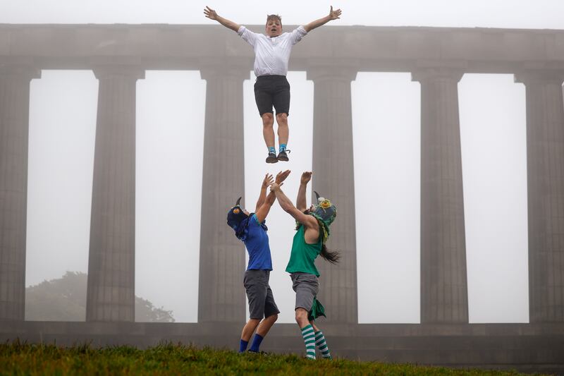Performers from Brainfools Luck Pigeons on Calton Hill in Edinburgh, Scotland on Tuesday, preparing for their show at the Edinburgh Fringe Festival. Getty Images
