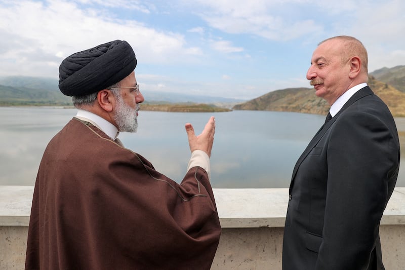 President Raisi and Azerbaijan's President Ilham Aliyev visit the Qiz-Qalasi dam on the Azerbaijan-Iran border on May 19. Reuters 