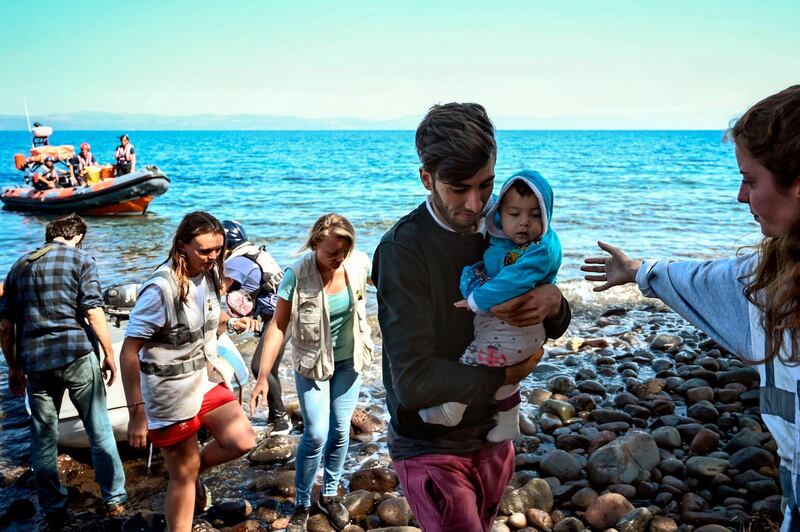 Migrants arrive on the Greek island of Lesbos after crossing the Aegean Sea from Turkey. AFP