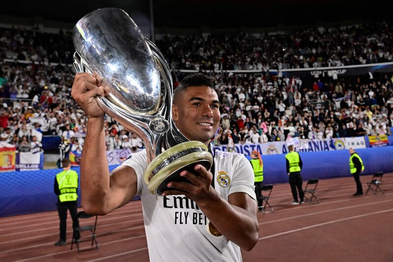 Real Madrid's man-of-the-match Casemiro celebrates with  the Uefa Super Cup trophy after his side beat Eintracht Frankfurt 2-0 in Helsinki, on August 10, 2022. AFP