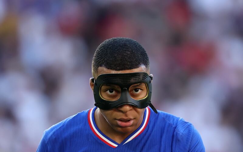 Kylian Mbappe of France wearing a protective mask after he broke his nose in the opening game against Austria. EPA 