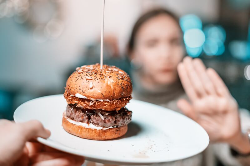 A limit of about one serving a week of red meat would be reasonable for people wishing to optimise their health and well-being, researchers said. Getty Images