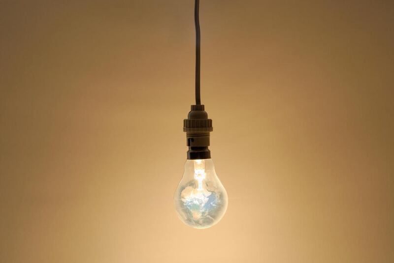 Bare hanging light bulb in studio