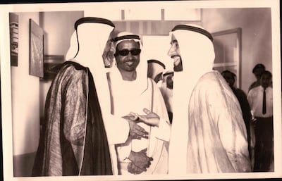Saleh Farah, centre, stands by UAE Founding Father, the late Sheikh Zayed bin Sultan Al Nahyan, right, and Sheikh Rashid bin Saeed Al Maktoum, then Ruler of Dubai. Photo: family