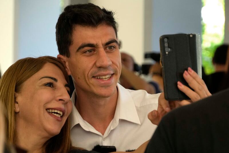 A woman takes a selfie with popular YouTuber and TikToker Fidias Panayiotou in Nicosia, Cyprus, on Tuesday. AP
