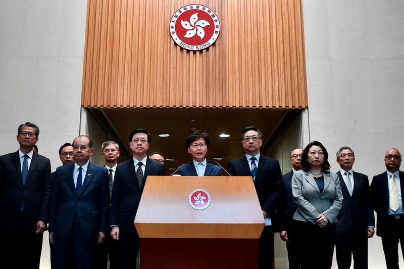Hong Kong Chief Executive Carrie Lam, centre, speaks to the media during a press conference. AFP