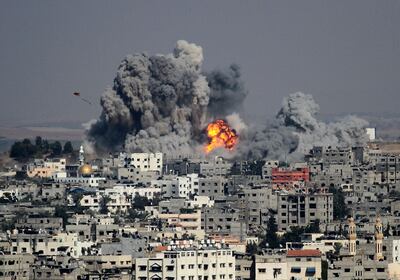 Smoke rises after an attack of Israeli aircraft on Gaza City in 2014.  Getty