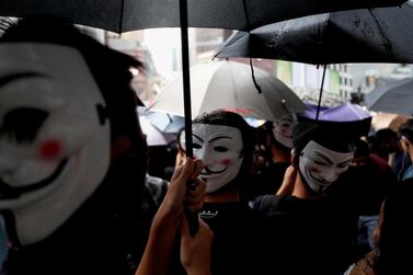 Protesters wearing masks gather during an anti-government rally at Causeway Bay, in Hong Kong, China October 6, 2019. Reuters