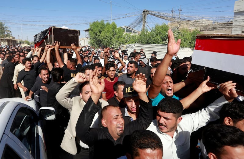 Mourners attend the funeral of the security men who were kidnapped and killed by Islamic State militants, in Kerbala, Iraq June 28, 2018. REUTERS/Alaa al-Marjani