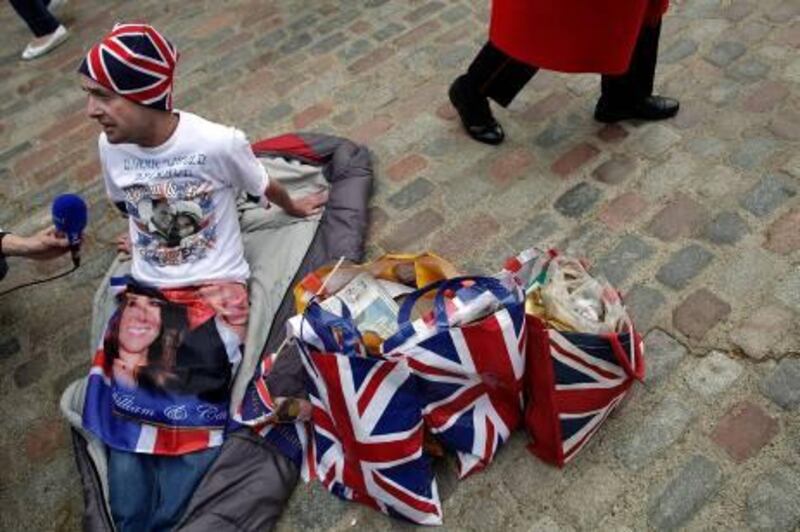 LONDON, ENGLAND - APRIL 26:  Royal fan John Loughrey talks to foreign media as he becomes the first person to camp out on the streets to wait for the start of the Royal Wedding on April 26, 2011 in London, England. With only two full days to go before the Royal Wedding, security checks and last minute preparations are continuing around Westminster Abbey, Buckingham Palace and on the route the couple will take.  (Photo by Matthew Lloyd/Getty Images) *** Local Caption ***  GYI0064462207.jpg