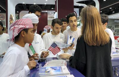ABU DHABI , UNITED ARAB EMIRATES , OCT 25   – 2017 :- Students from Al Khazna School , Al Ain enquiring about the Universities at the USA stand in the Najah Education Fair held at ADNEC in Abu Dhabi. (Pawan Singh / The National) Story by Roberta 