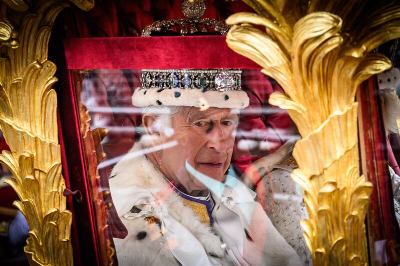 King Charles begins the journey back to Buckingham Palace in the Gold State Coach. AFP