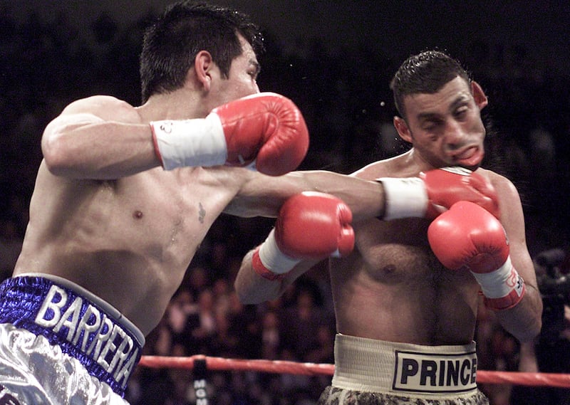 Marco Antonio Barrera from Mexico connects with a left against Prince Naseem Hamed. AFP