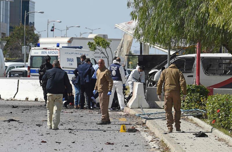 Police and forensic experts inspect the scene of an explosion near the US embassy in the Tunisian capital Tunis. AFP
