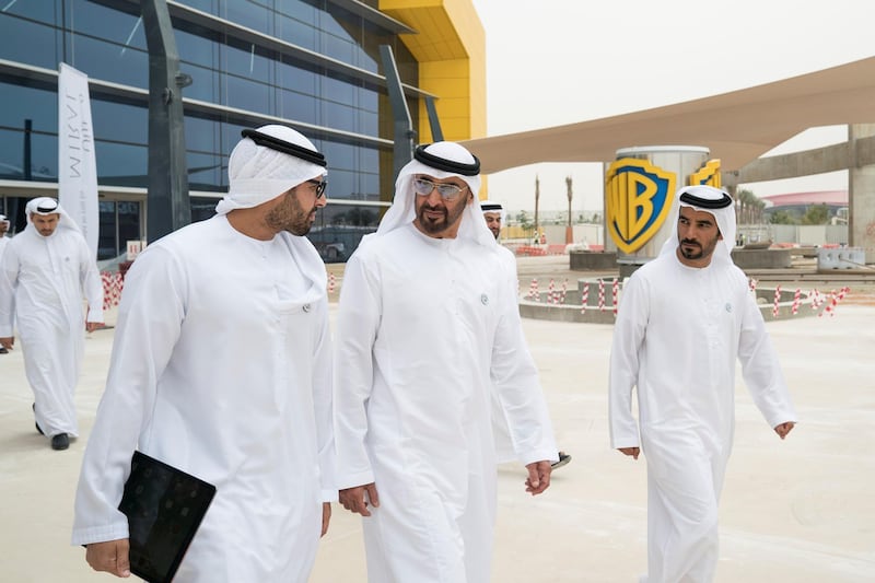 YAS ISLAND, ABU DHABI, UNITED ARAB EMIRATES -  March 1, 2018: HH Sheikh Mohamed bin Zayed Al Nahyan, Crown Prince of Abu Dhabi and Deputy Supreme Commander of the UAE Armed Forces (C), inspects construction of Warner Bros World Abu Dhabi with HE Mohamed Khalifa Al Mubarak Chairman of the Department of Culture and Tourism and Abu Dhabi Executive Council Member (L), and Mohamed Abdalla Al Zaabi CEO of Miral (R). 
( Ryan Carter for the Crown Prince Court - Abu Dhabi )
---