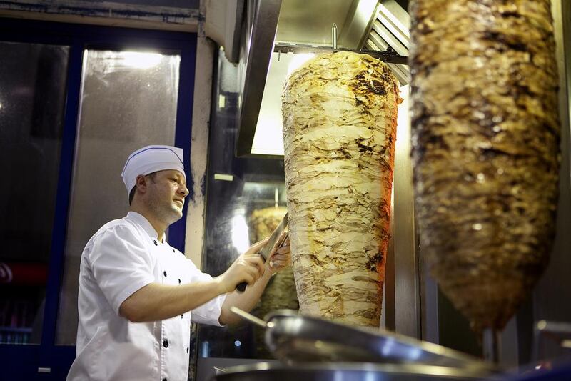 A Syrian shawarma cook hard at work at Mansour Restaurant, formerly Al Safadi. Silvia Razgova / The National 